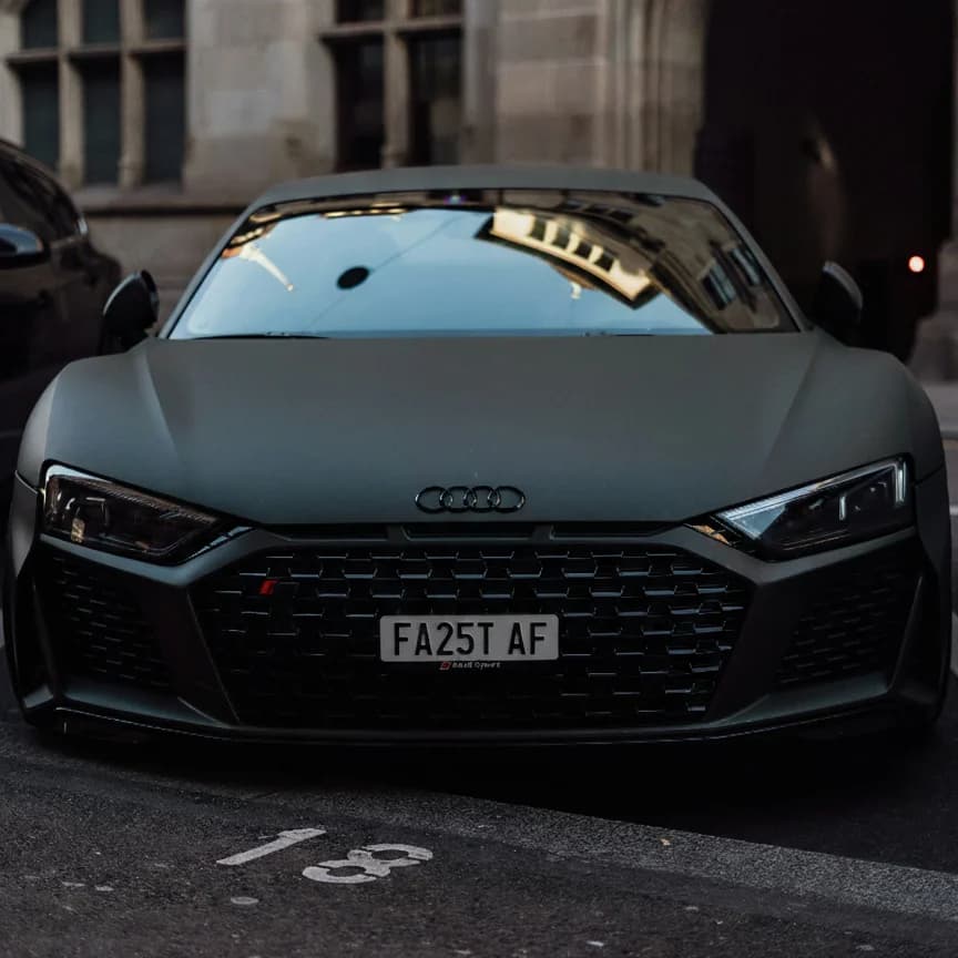 Photo of a wrapped matte black Audi R8 showing the private number plate FA25 TAF, which reads as Fast AF and is currently available for sale for £11,450.